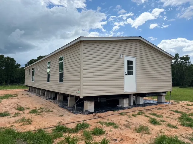 A mobile home re-levelling is in progress.